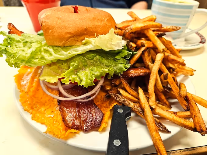 Burger and fries served on a plate at a Chilliwack café