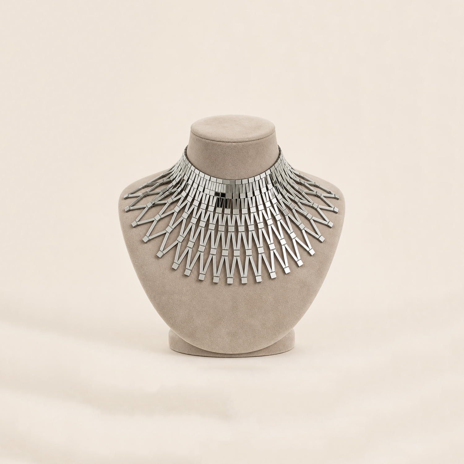 Cleo leather and mirrored acrylic necklace displayed on a beige bust.