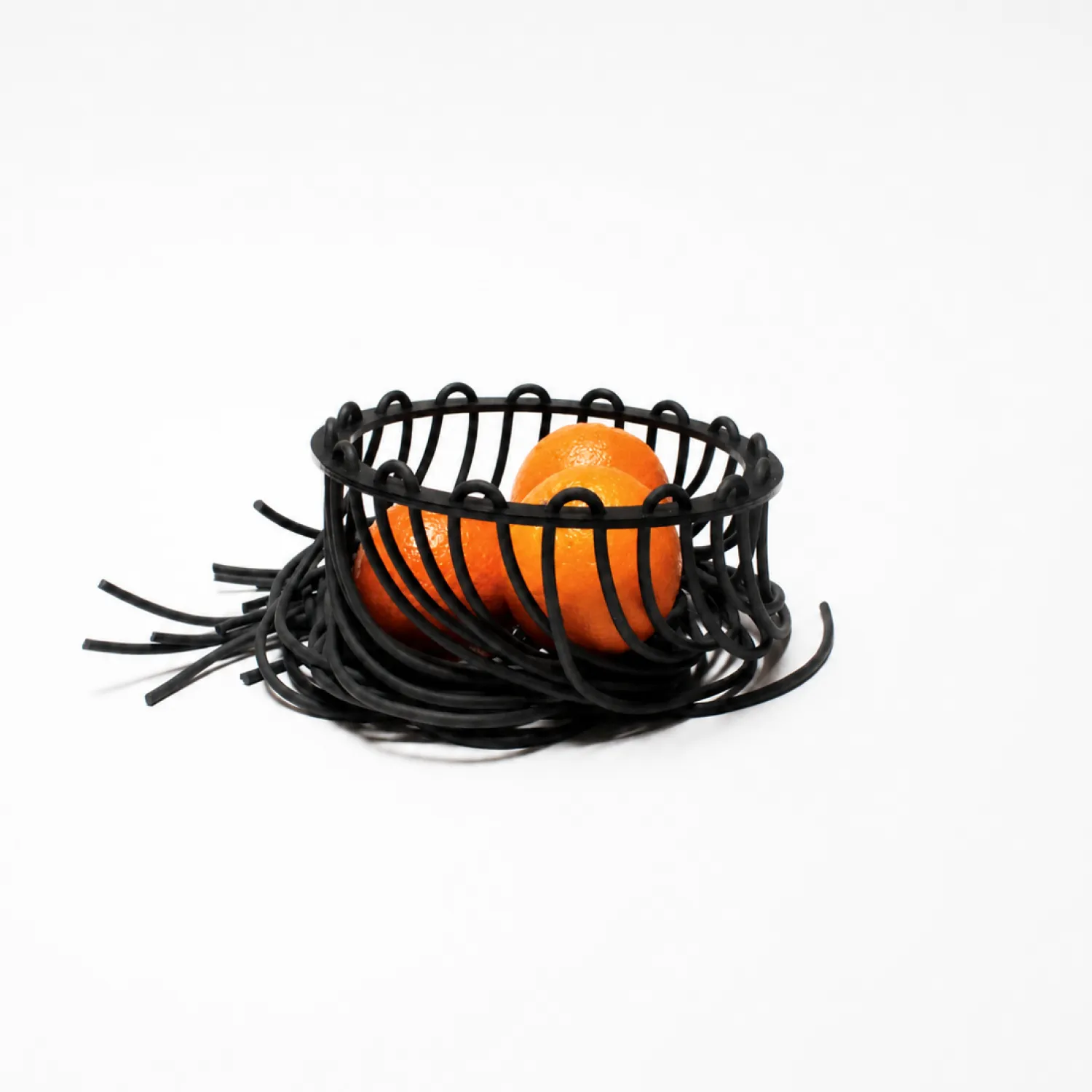 Black Lace fruit bowl holding oranges, shown assembled on a white background.