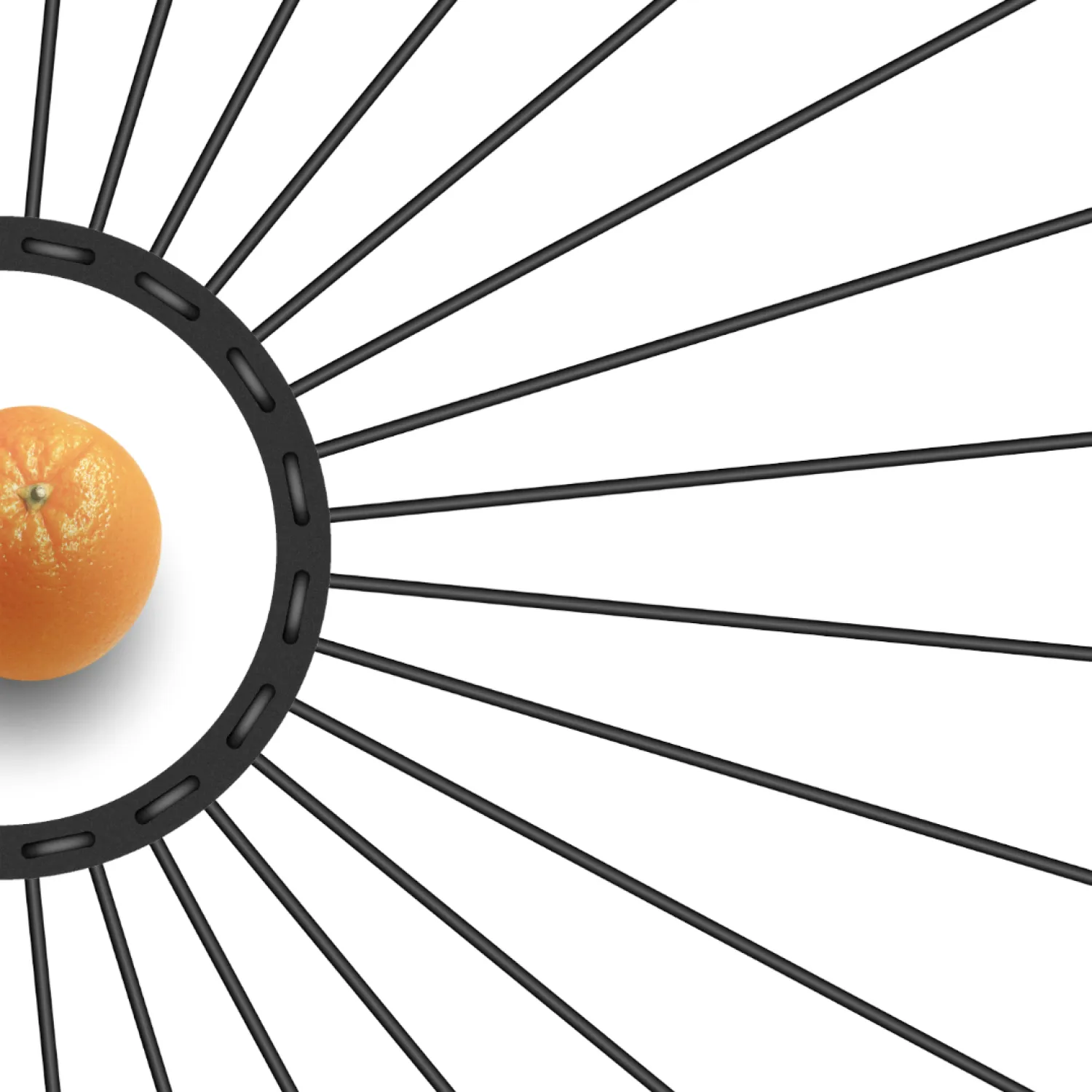 Detail of the perforated Lace ring and black rubber cords laid flat around an orange.