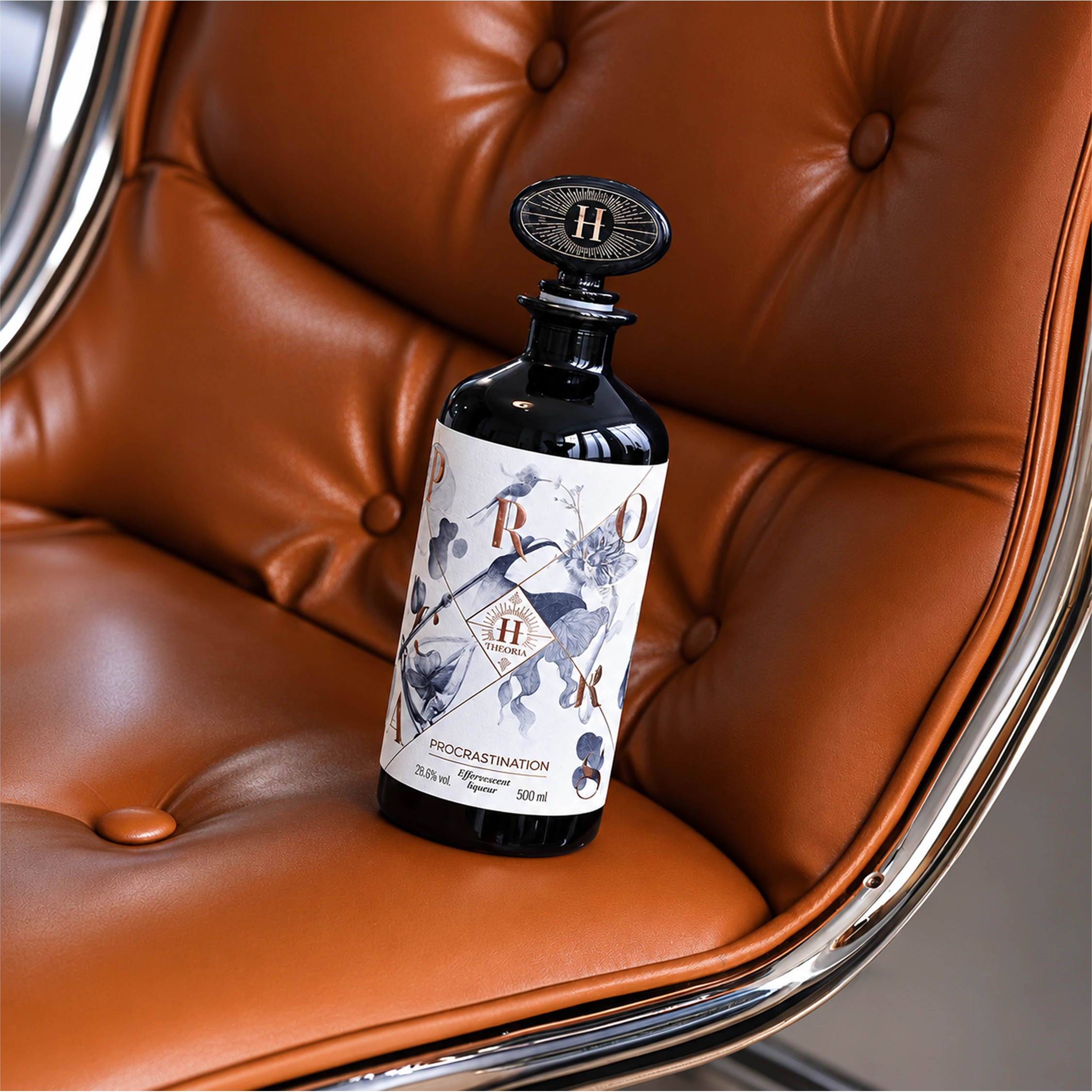 A dark bottle with an illustrated label resting on a cognac leather chair.
