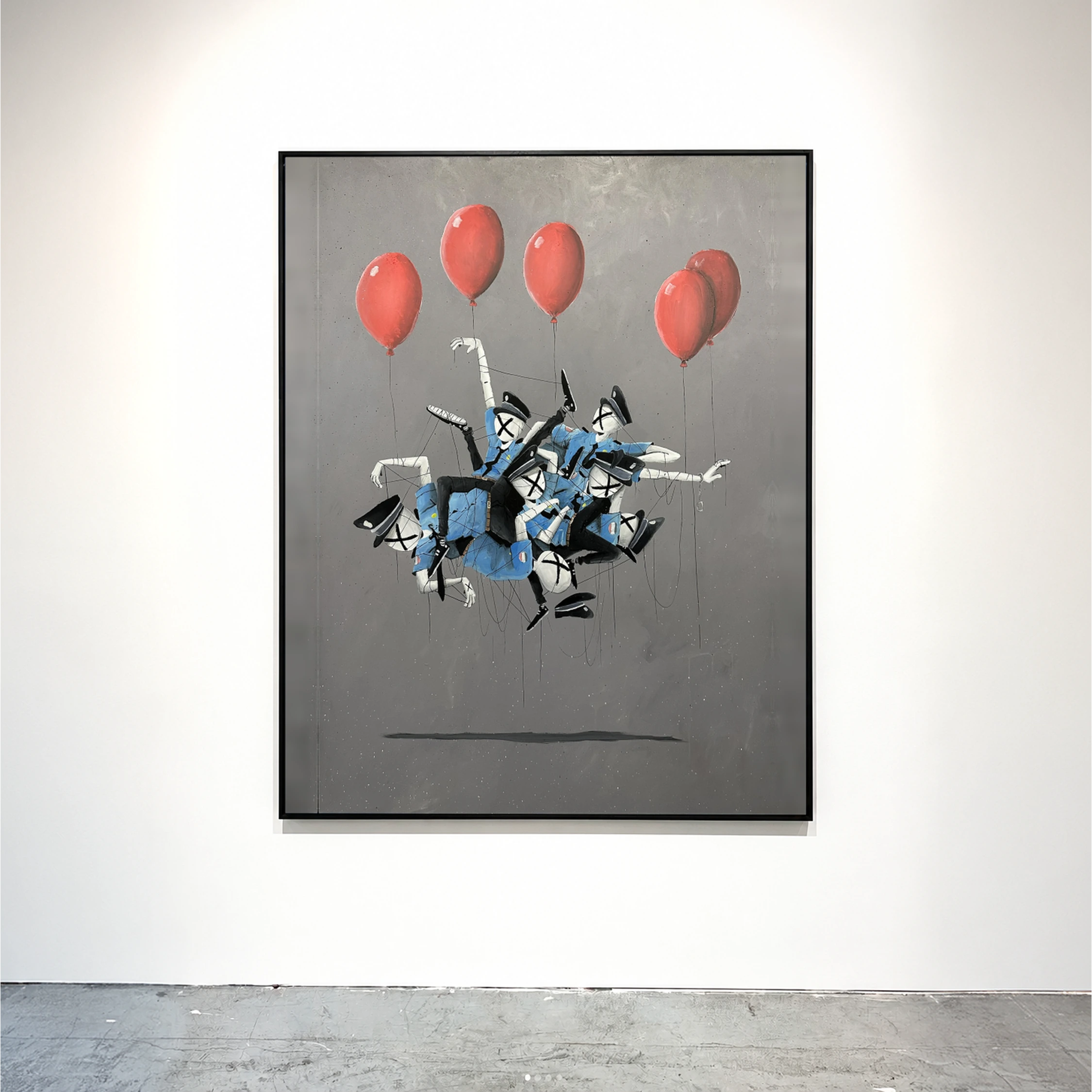 A framed grey painting with floating figures and red balloons.