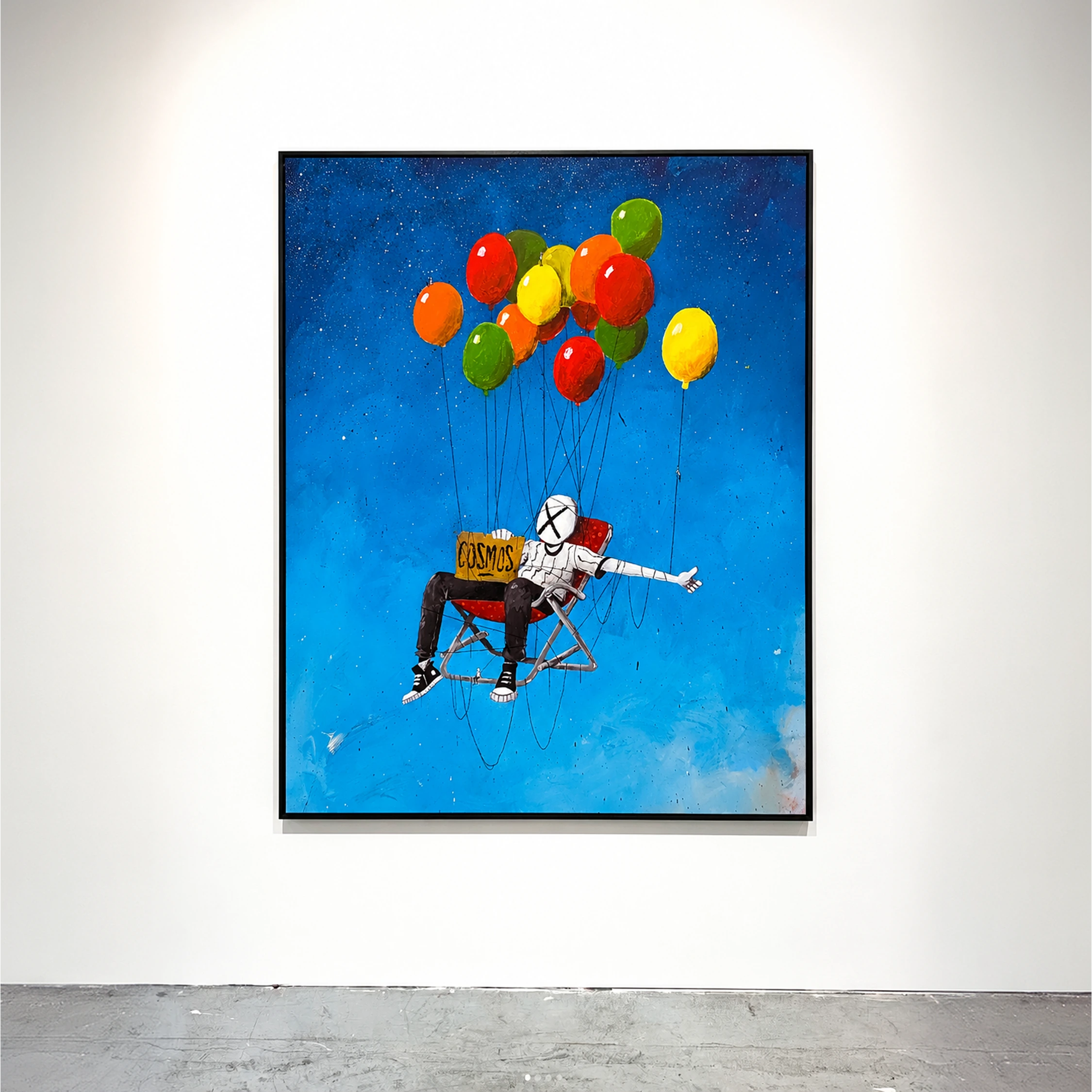A framed painting of a masked figure lifted by colourful balloons against a blue sky.