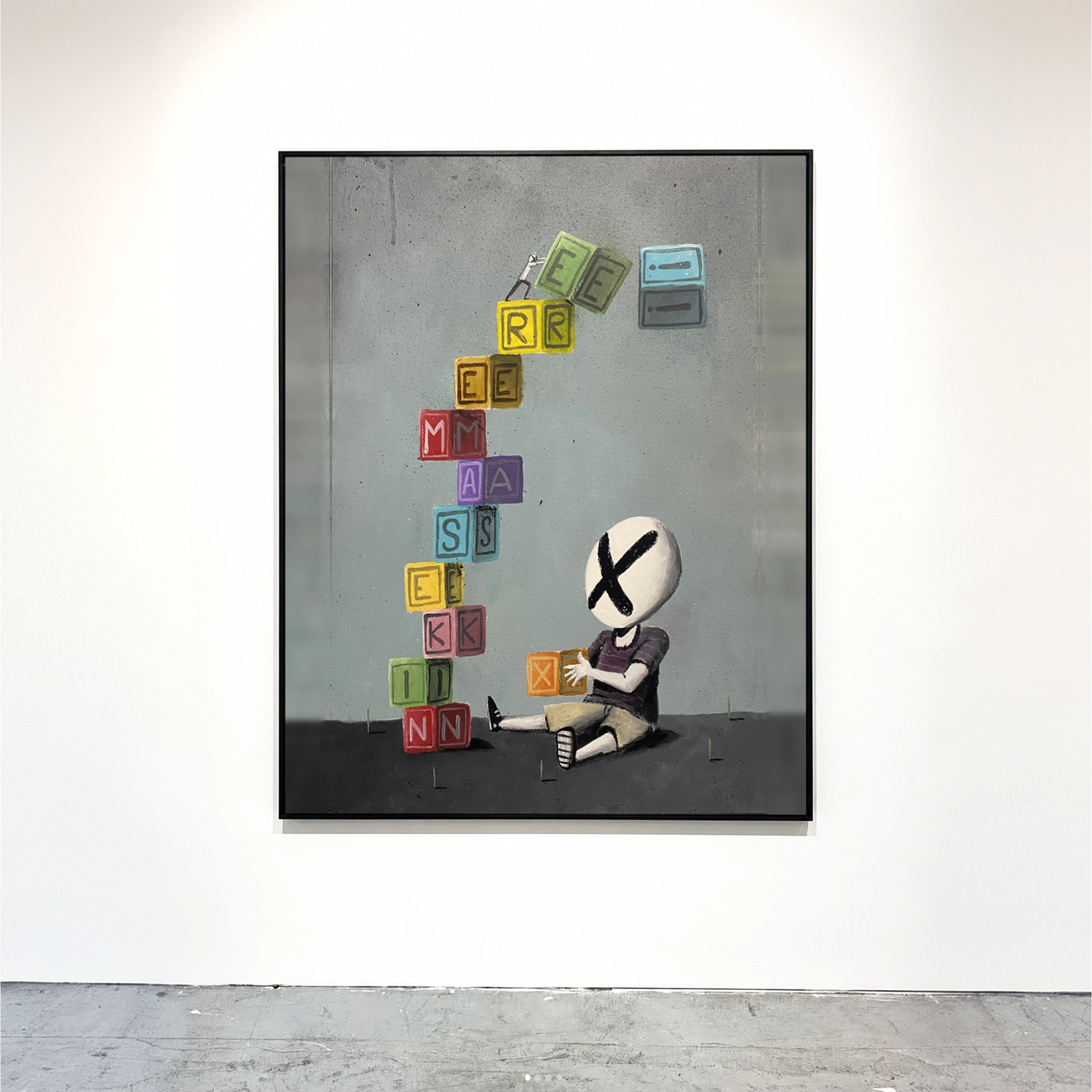 A framed painting of a small masked figure beneath a stack of colourful letter blocks.