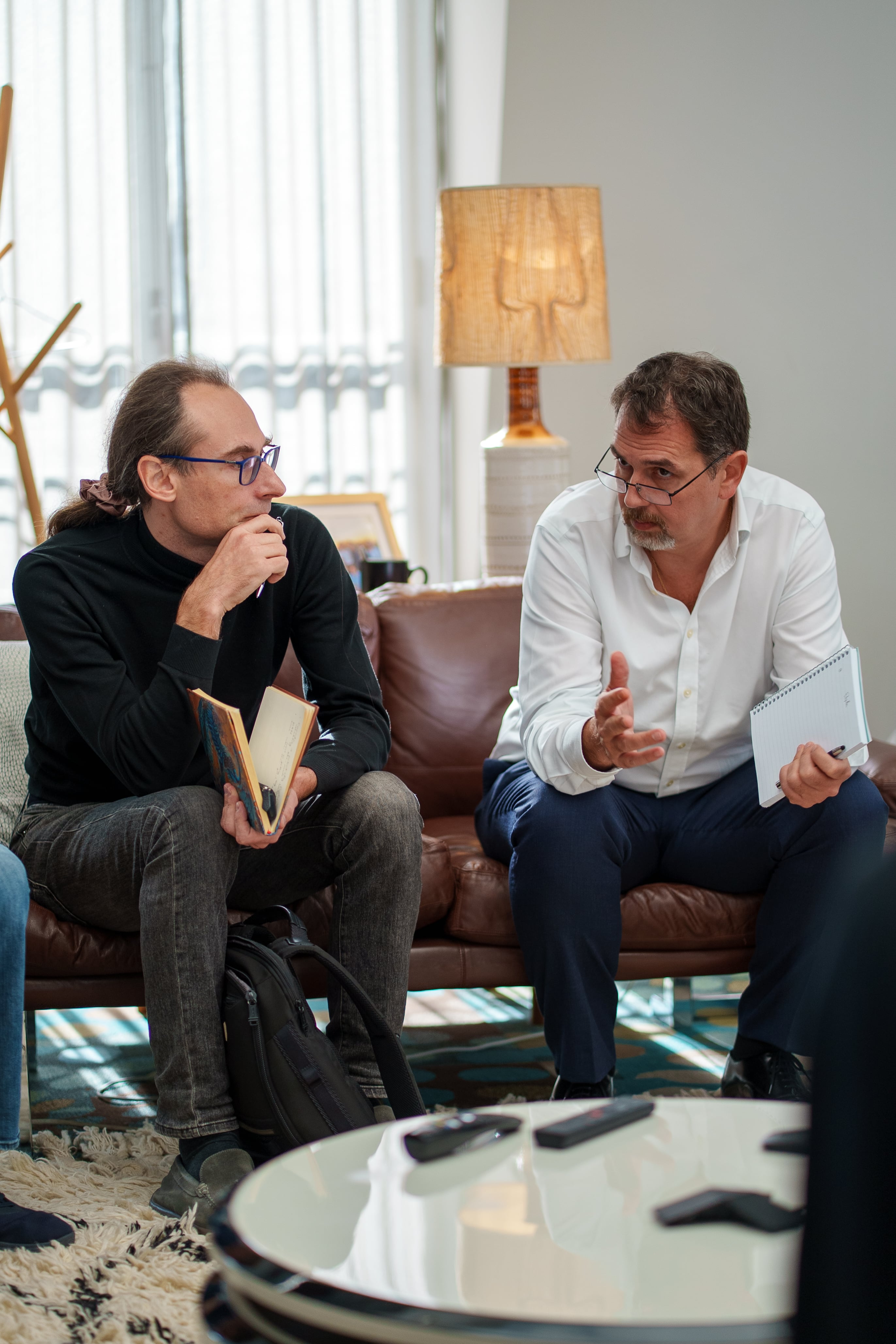 Alex Bronstein and Apostolos Katsaris collaborating in a business meeting.