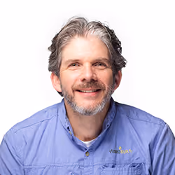 Professional headshot of Boris Wullner, a man with short hair, smiling in a dark suit.