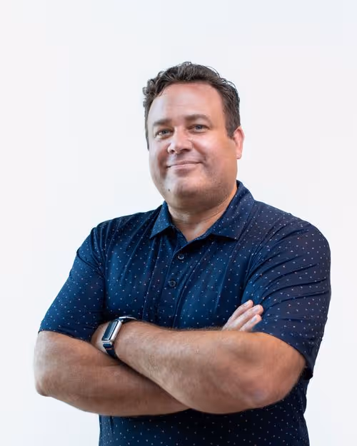 Professional headshot of Ted Kennedy, Jr., a man with graying hair, smiling against a neutral background.