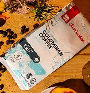 A bag of Colombian coffee sits on a table.