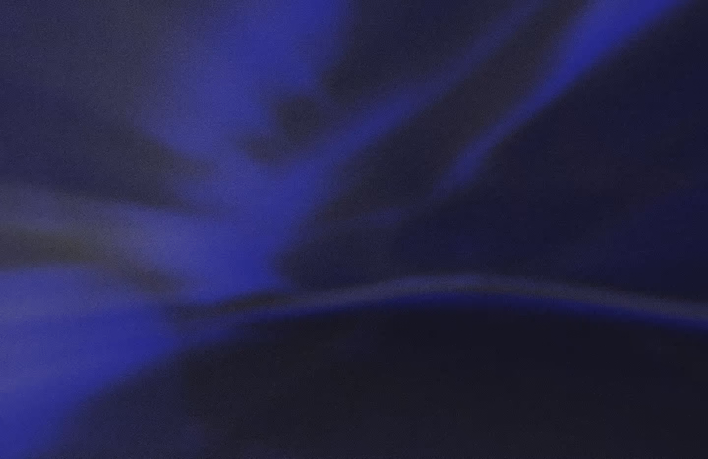 Abstract dark image with blue and black gradient shades and a textured appearance.