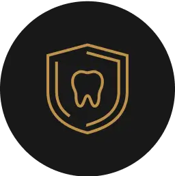 Gold dental protection shield icon on black background.