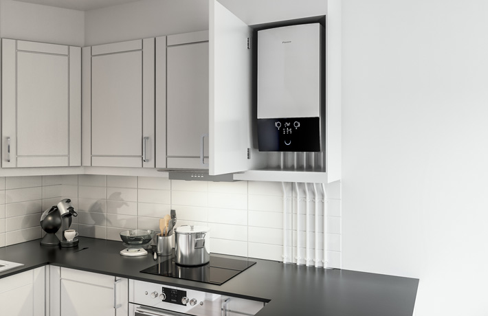 Modern kitchen with white cabinets and a wall-mounted boiler inside an open cabinet above the stove.