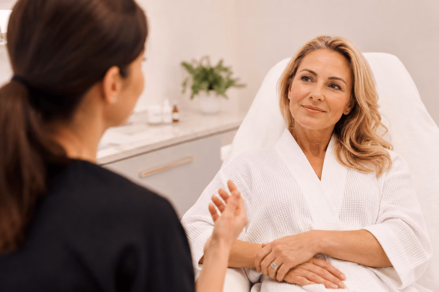 Woman receiving medspa facial treatment in Cary, North Carolina for hormonal skin changes