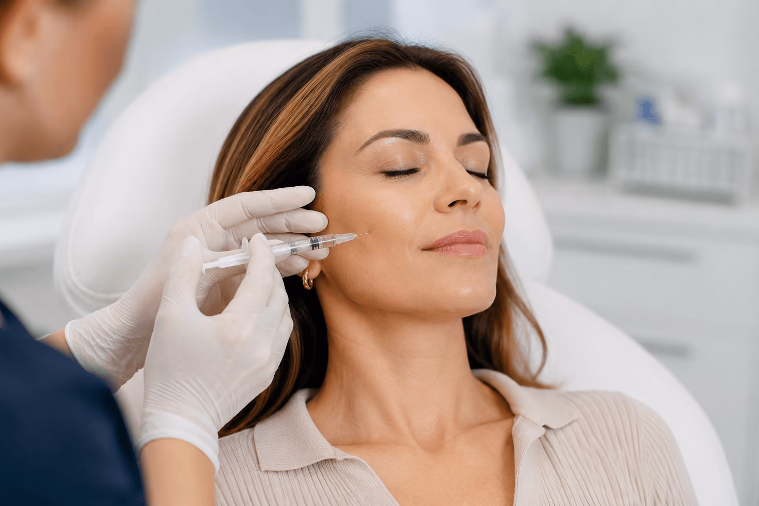 Woman receiving Sculptra treatment at a medical spa in Cary, North Carolina to naturally restore facial volume through collagen stimulation.
