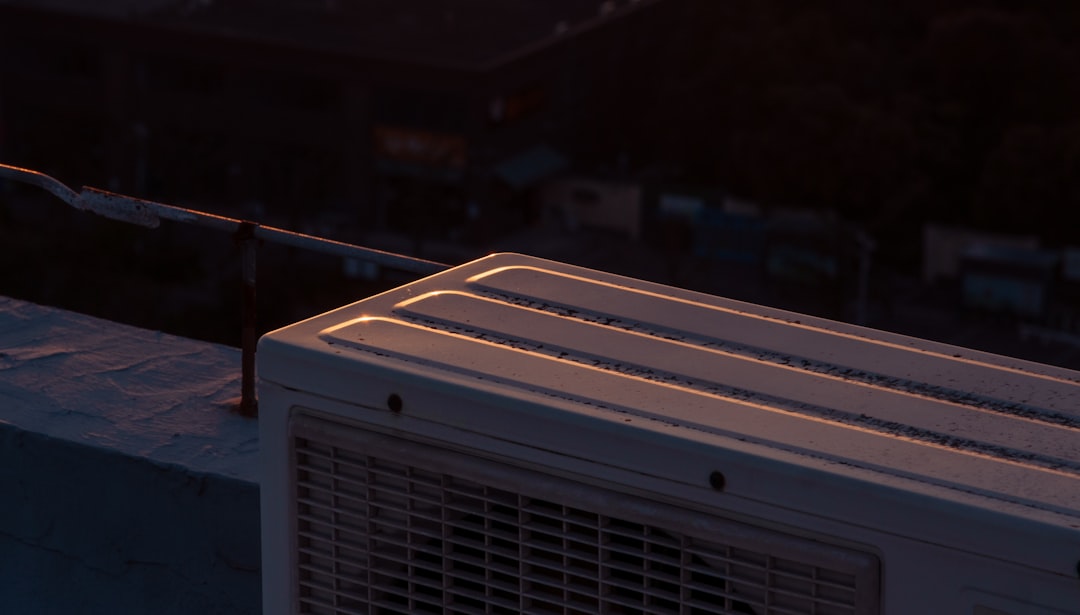 Infographic showing how a commercial heat pump transfers heat between indoor and outdoor units for both heating and cooling, with arrows indicating refrigerant flow direction in winter and summer modes - commercial heat pump service in bend, or