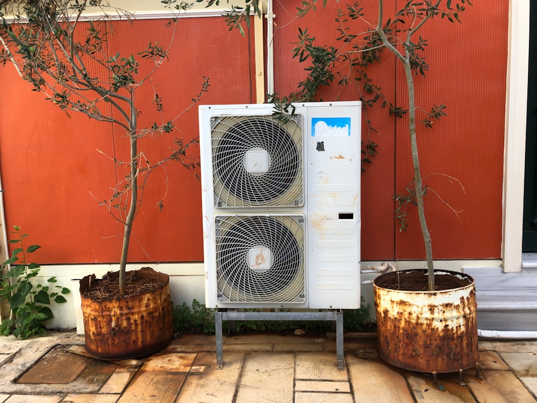 infographic showing heat pump providing heating in winter and cooling in summer with arrows indicating air flow direction and temperature changes throughout the seasons - heat pump replacement company in sisters, or
