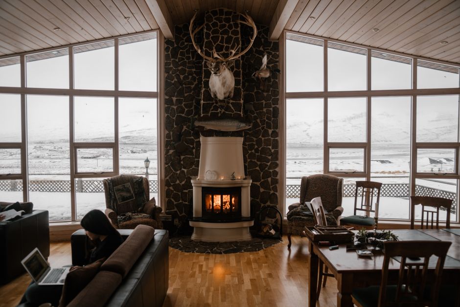 cozy living room with snowy mountain view through window - affordable heating in sisters, or
