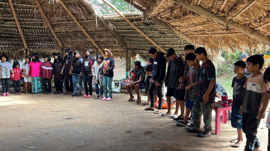 Local kids gathered in covered area for missions outreach