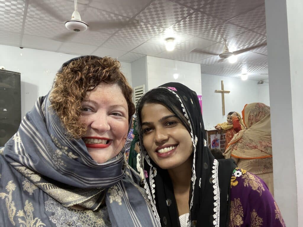Annie B posing in a sari with a South Asian sister in Christ.