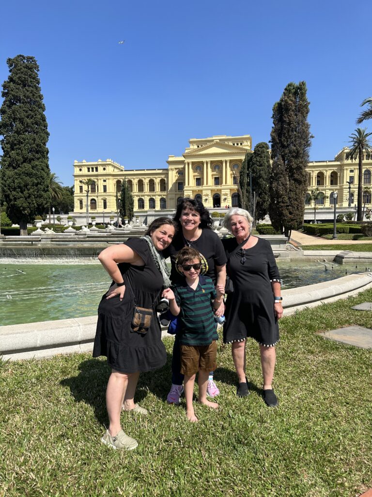 Friends posing outside interesting building in Brazil