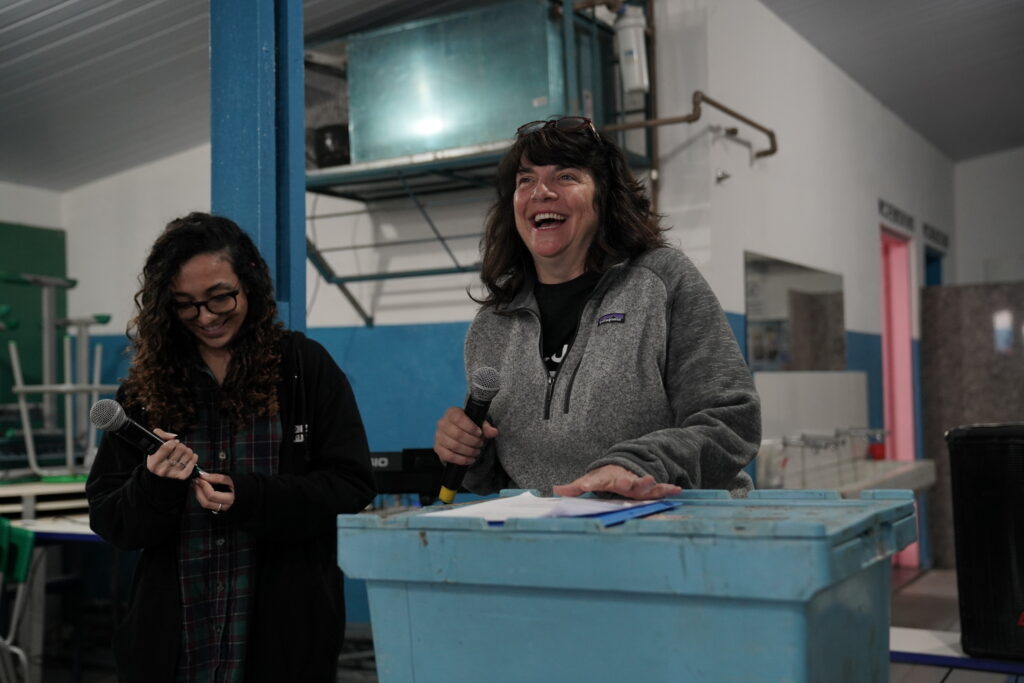 Tracy and a Portuguese translator speaking at an evangelistic event