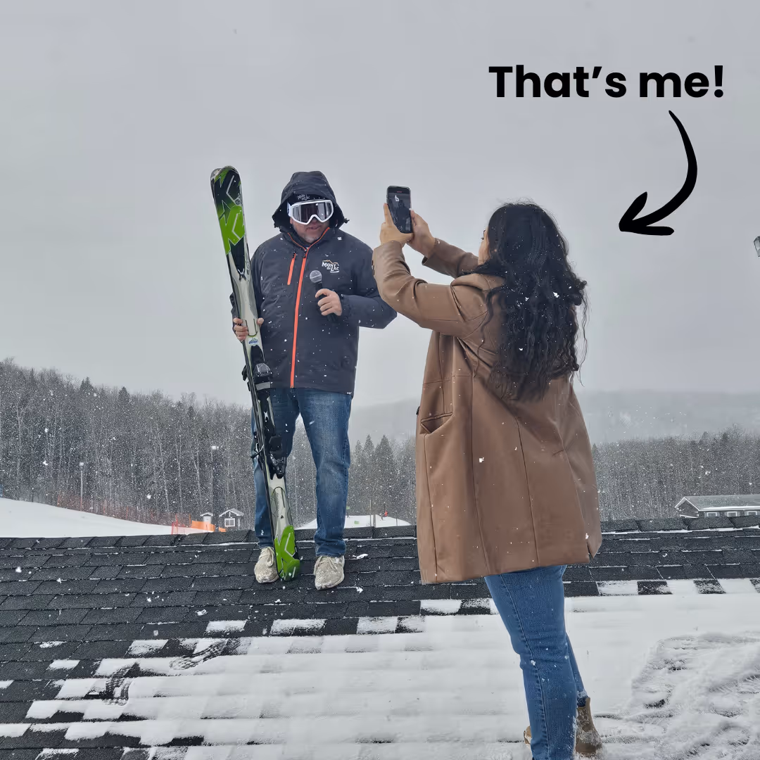 Girl taking video of someone on the roof