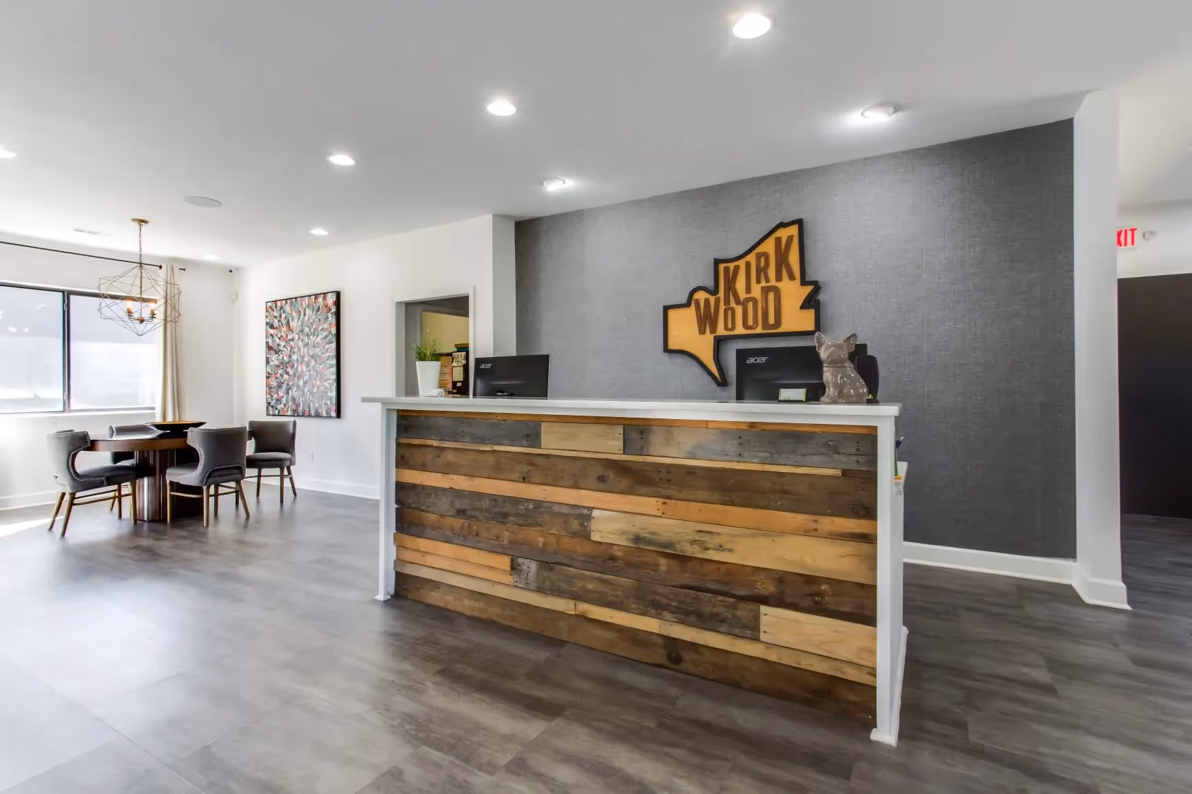 front desk with computers with kirkwood sign on wall