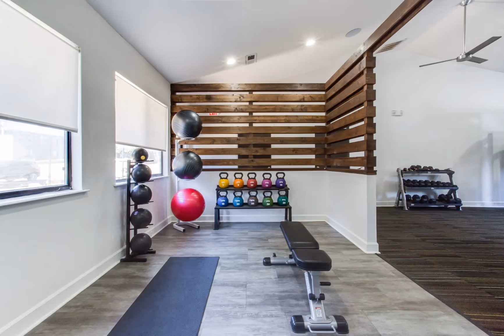 fitness center with yoga balls and weights
