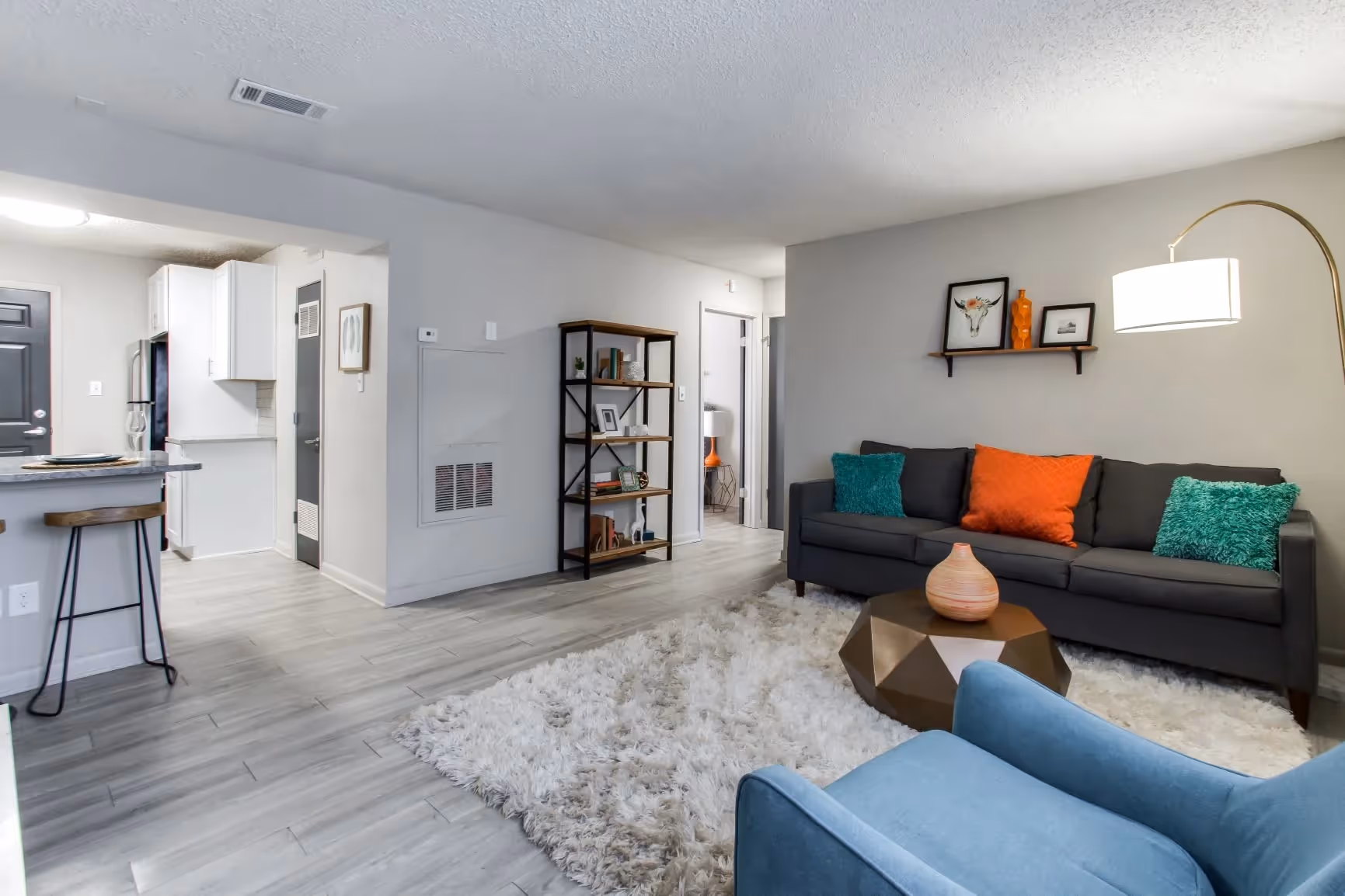 furnished living area with view of kitchen