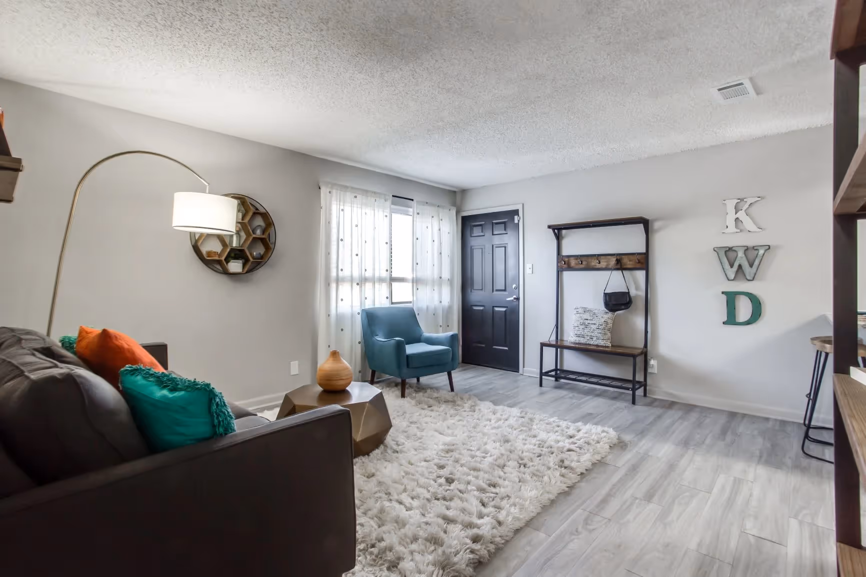 entry way and furnished living area 