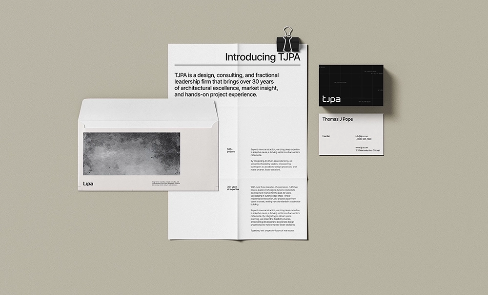 Minimalist brand stationery for TJPA featuring letterhead, envelope, and business cards.