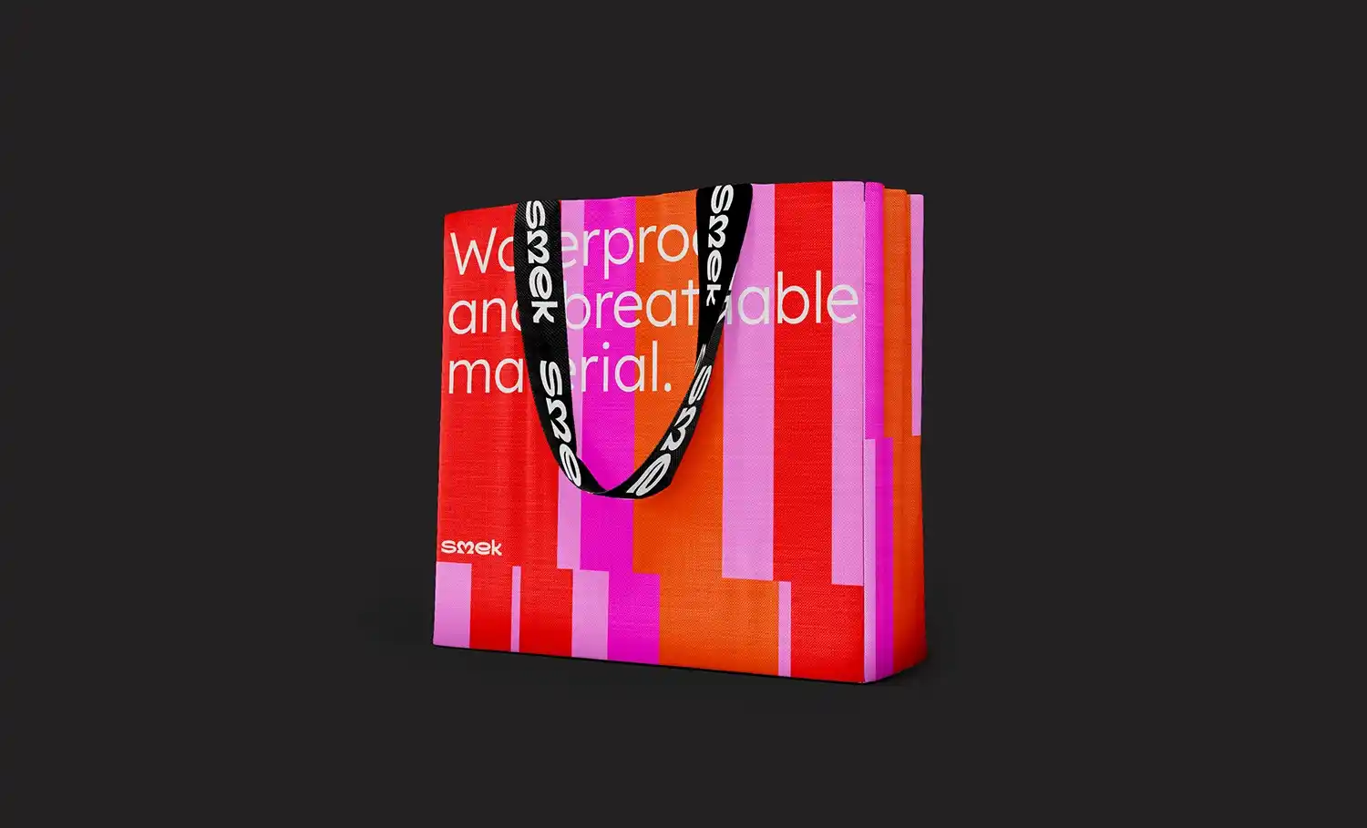 Red and pink patterned tote bag with white text.