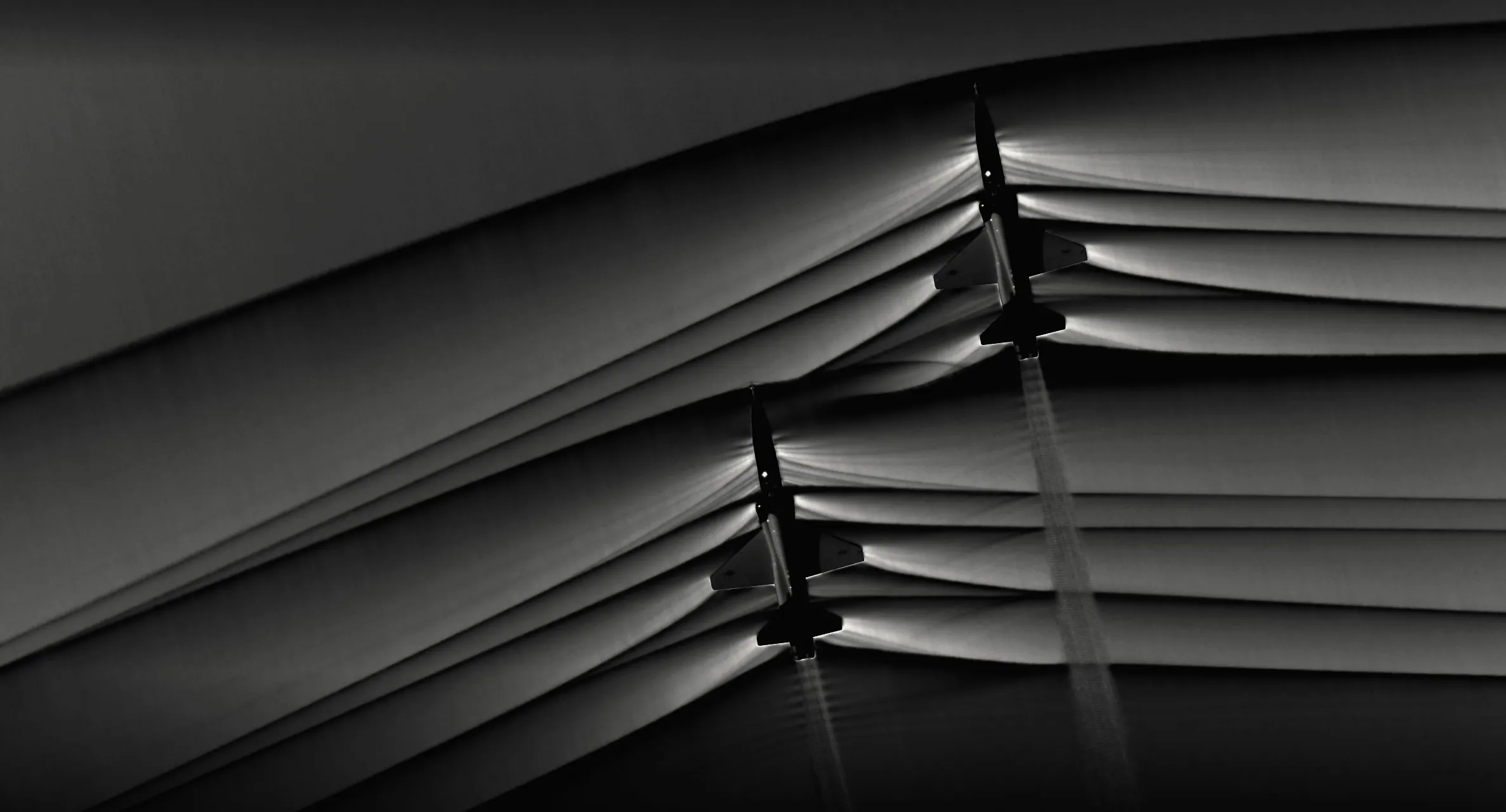 Shock waves from two supersonic T-38 aircraft, imaged by NASA with background-oriented schlieren