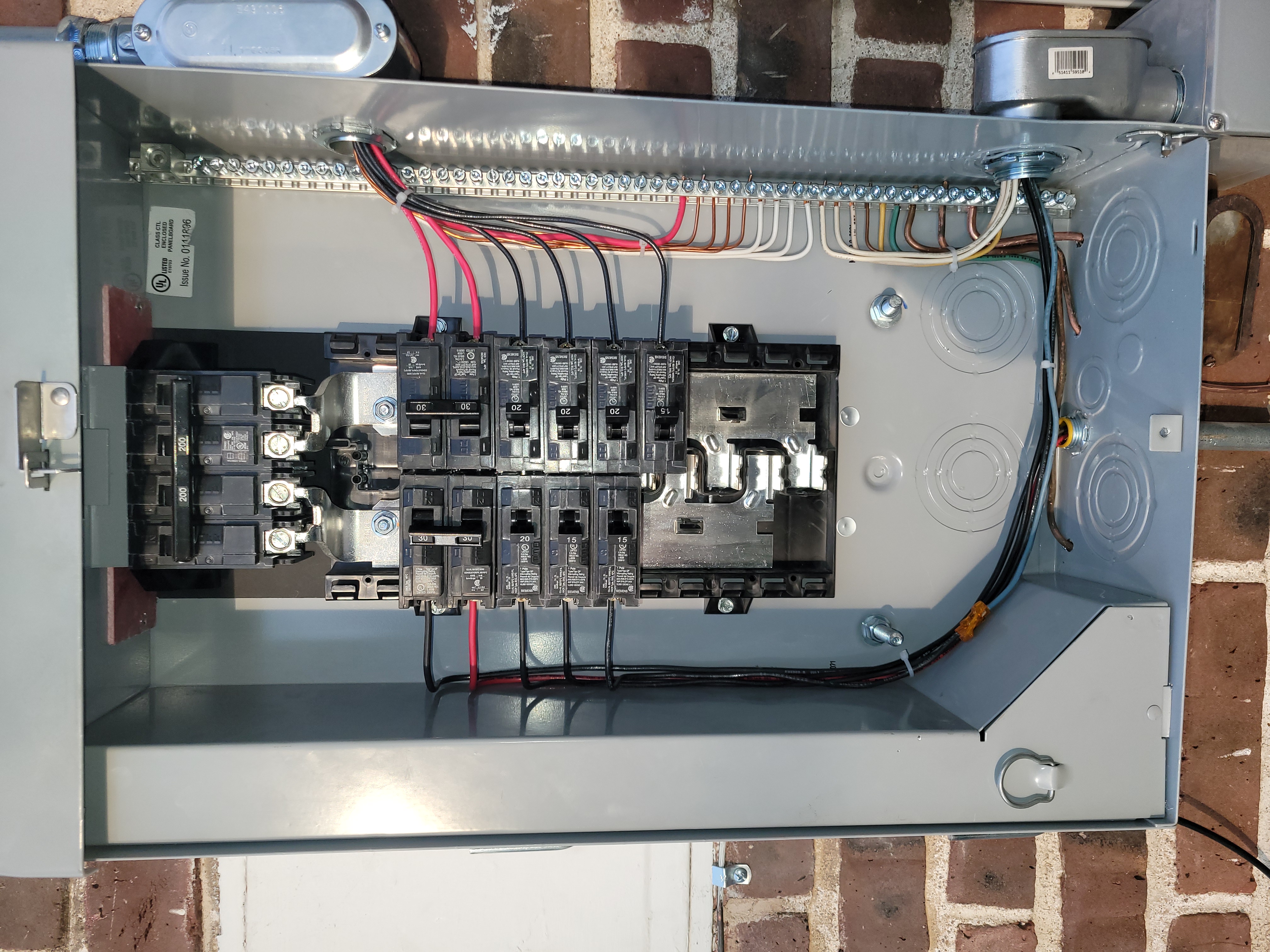Ace Electric electrician working on a residential electrical panel in Brighton, CO