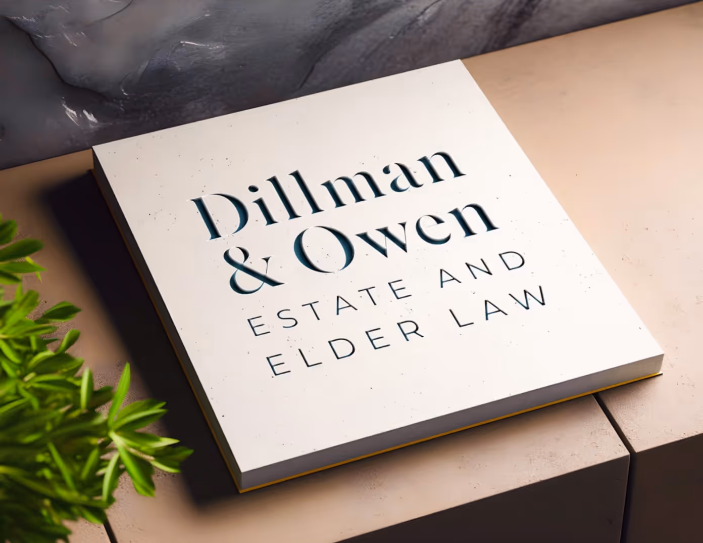 A mockup of a law firm logo on a coffee table book