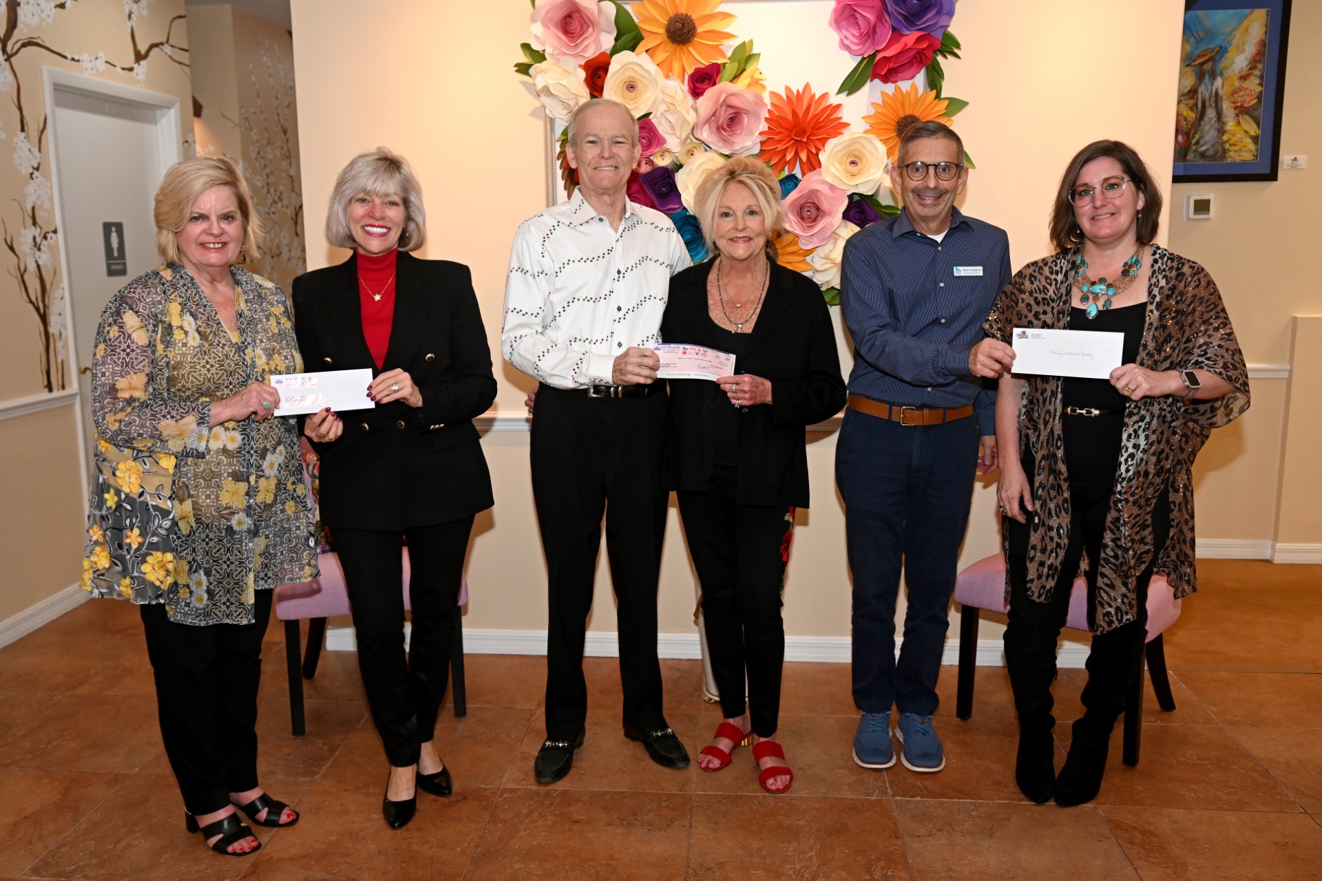 Donation check presentation at Mimi's Original Art