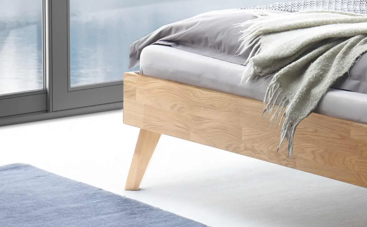 Wooden bed in bedroom