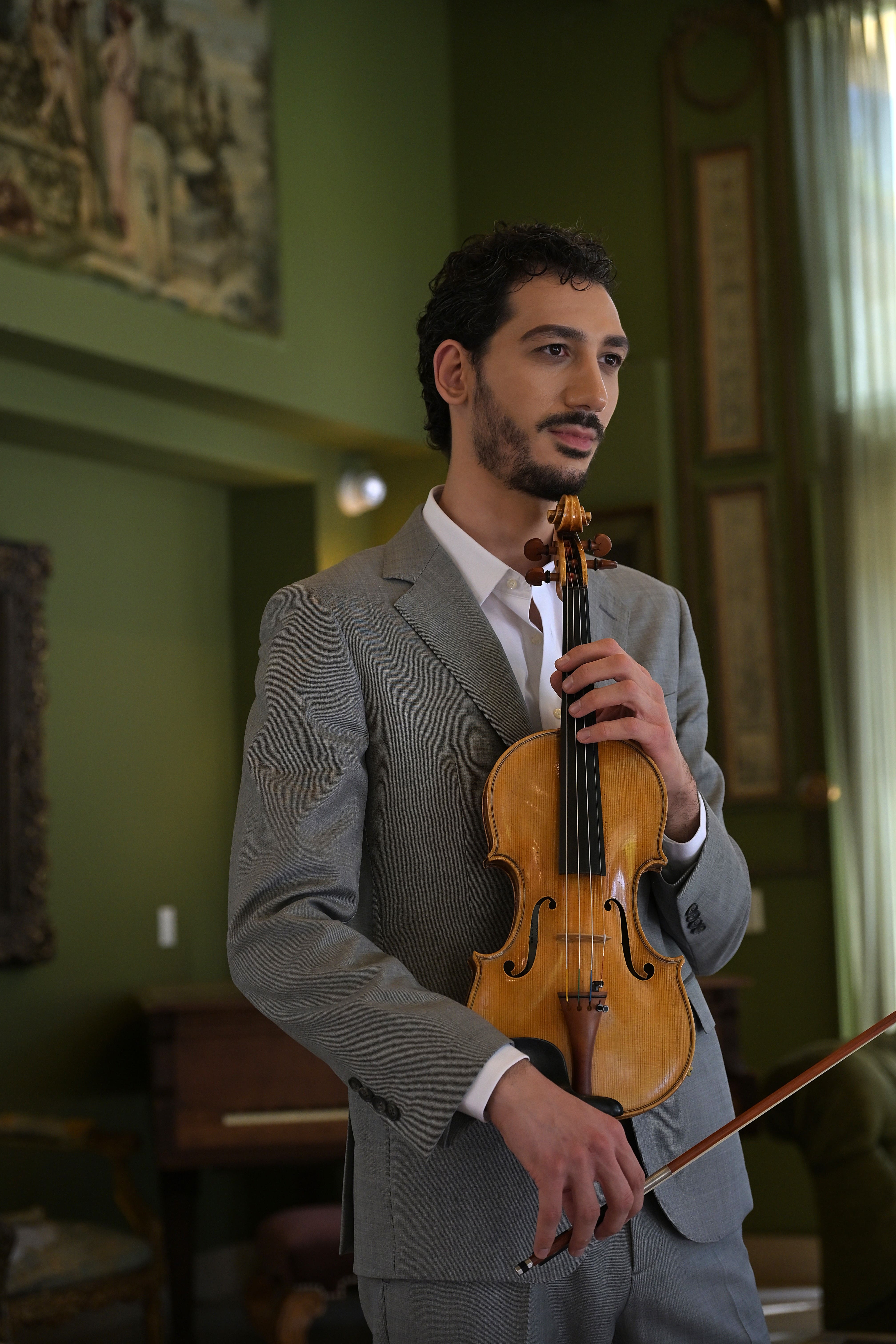 Nick Kelian holding a violin