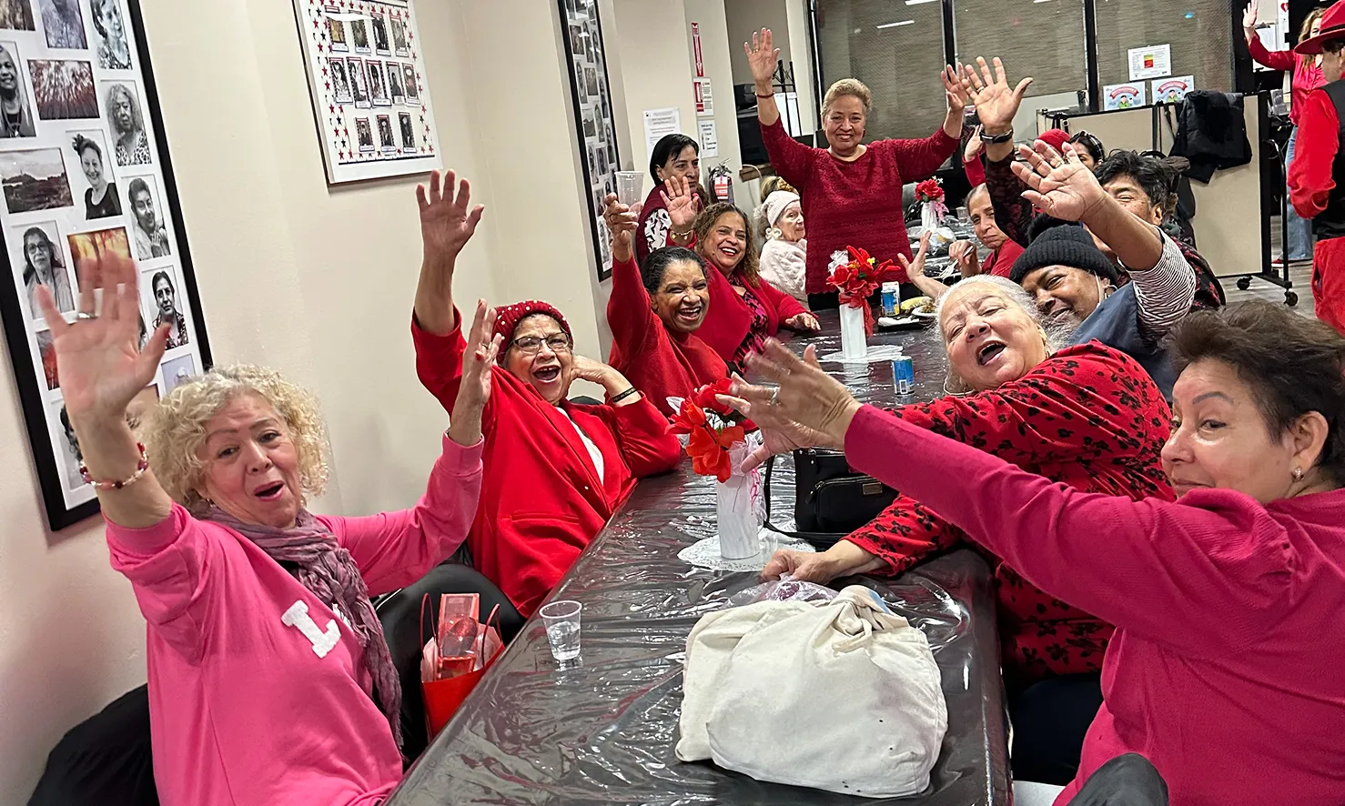Older adults participating in group activities and community events at a senior center in the Lower East Side