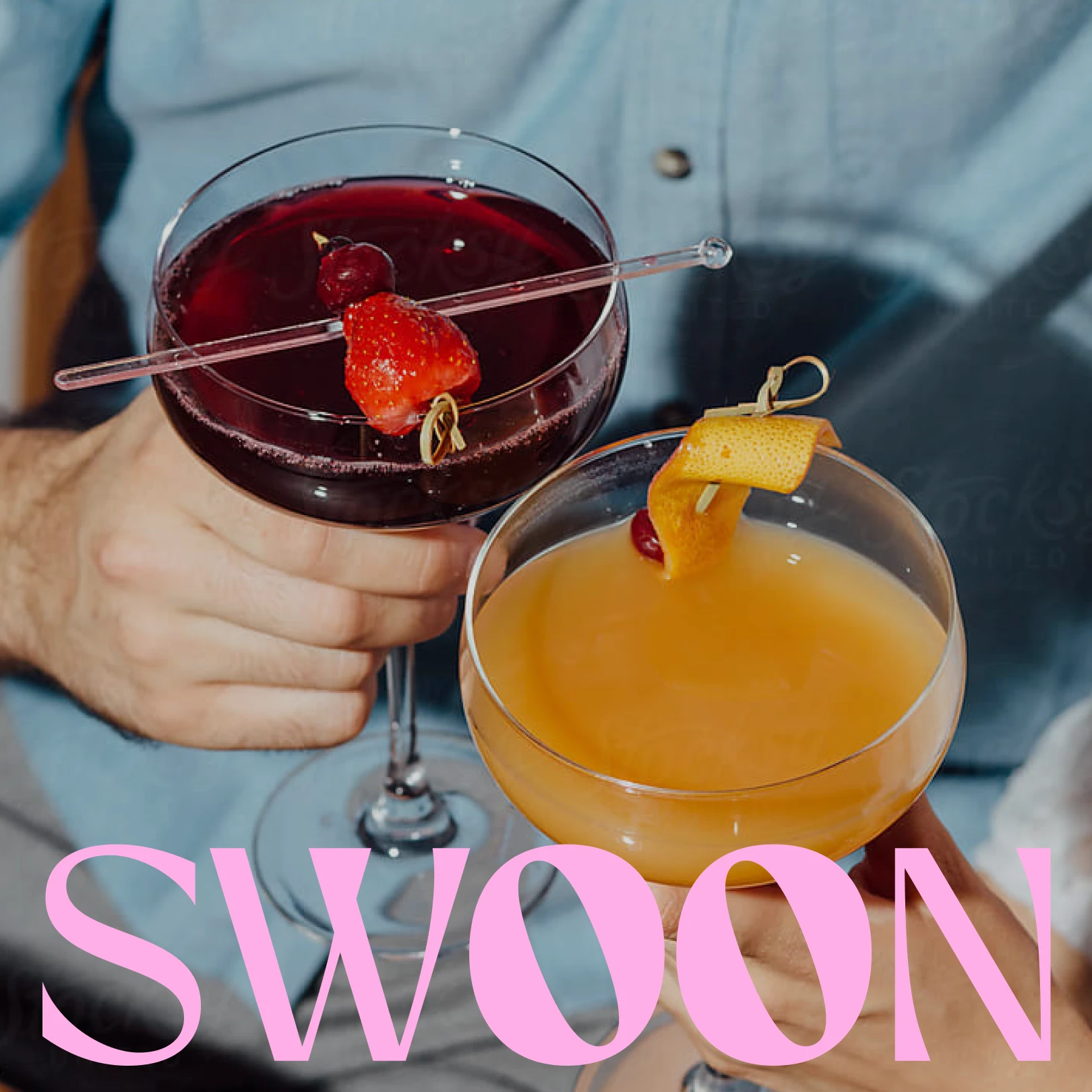 Two hands holding cocktail glasses, one with a dark red drink garnished with a strawberry and cherry, the other with an orange drink garnished with an orange peel and cherry.