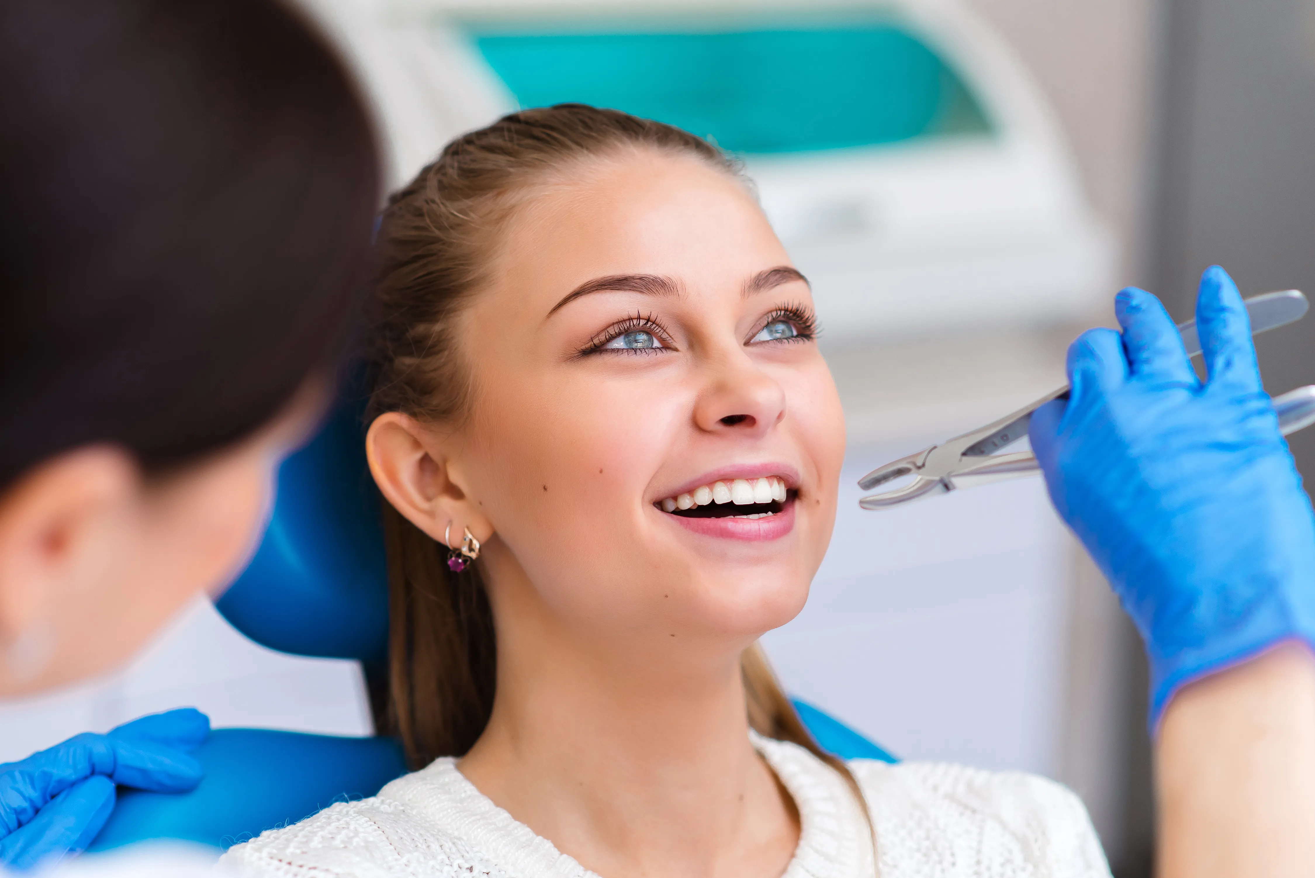 Dental patient receiving gentle tooth extraction at Legacy Dental Pasadena