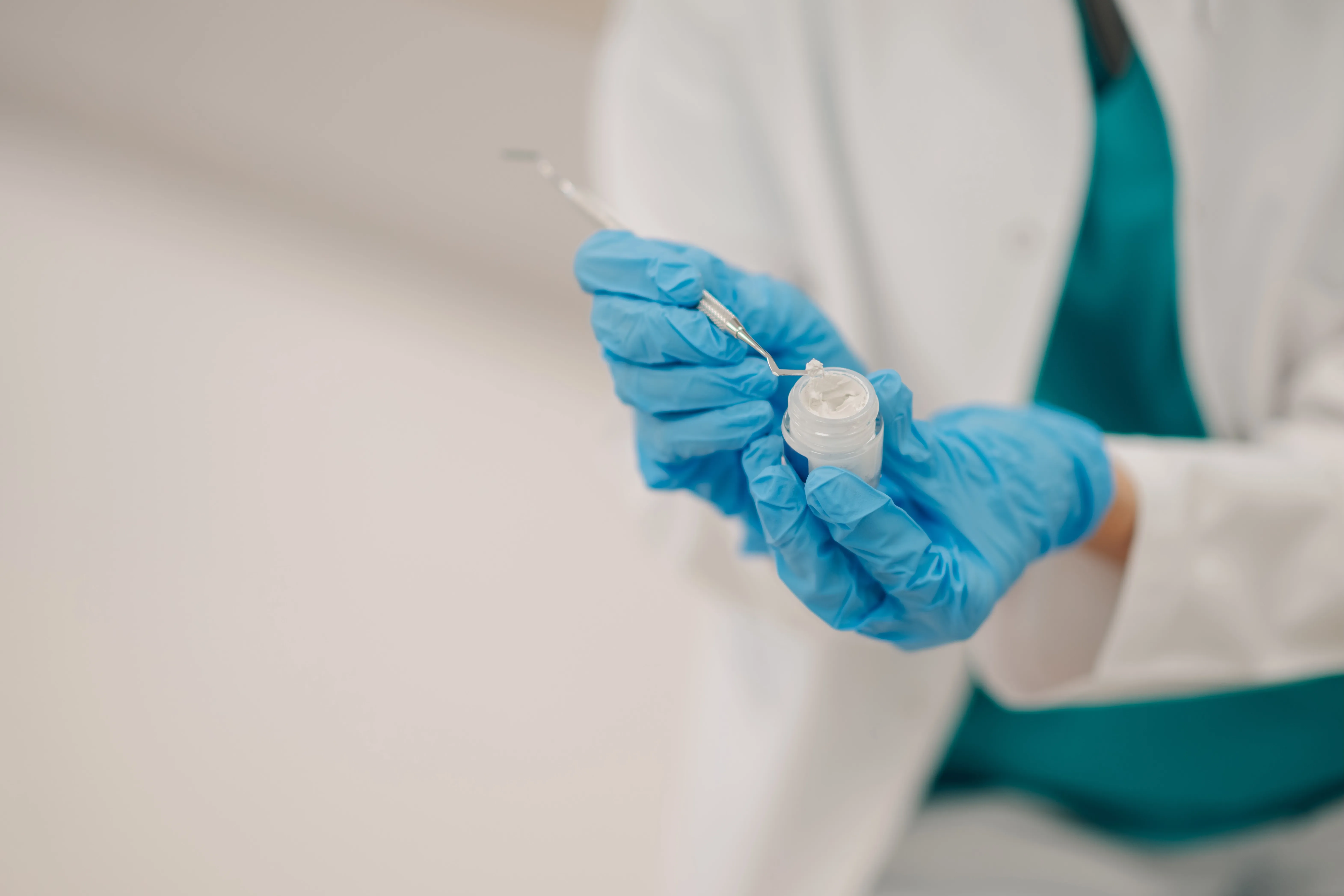 Illustration showing dental filling procedure: cavity removal and filling placement