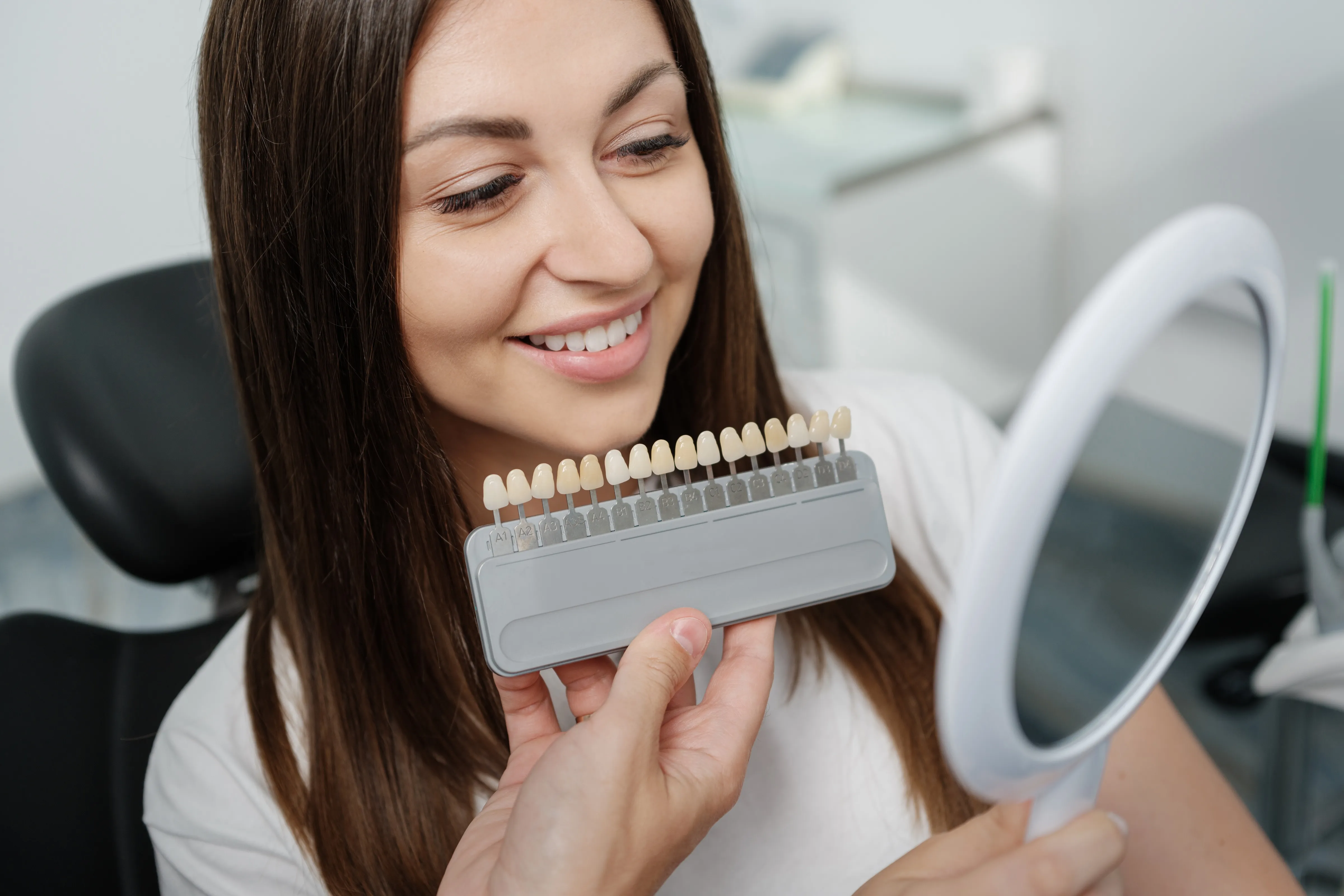 Patient receiving ceramic veneers and crowns treatment at Legacy Dental Pasadena