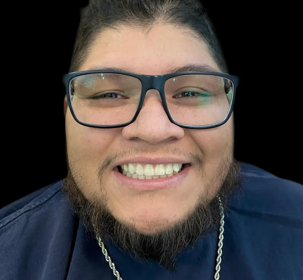 Patient showing a natural and confident smile after restorative dental work