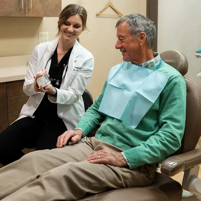 Dr. Weightman discussing All-on-X dental implant treatment with a patient during a consultation at Legacy Dental Pasadena