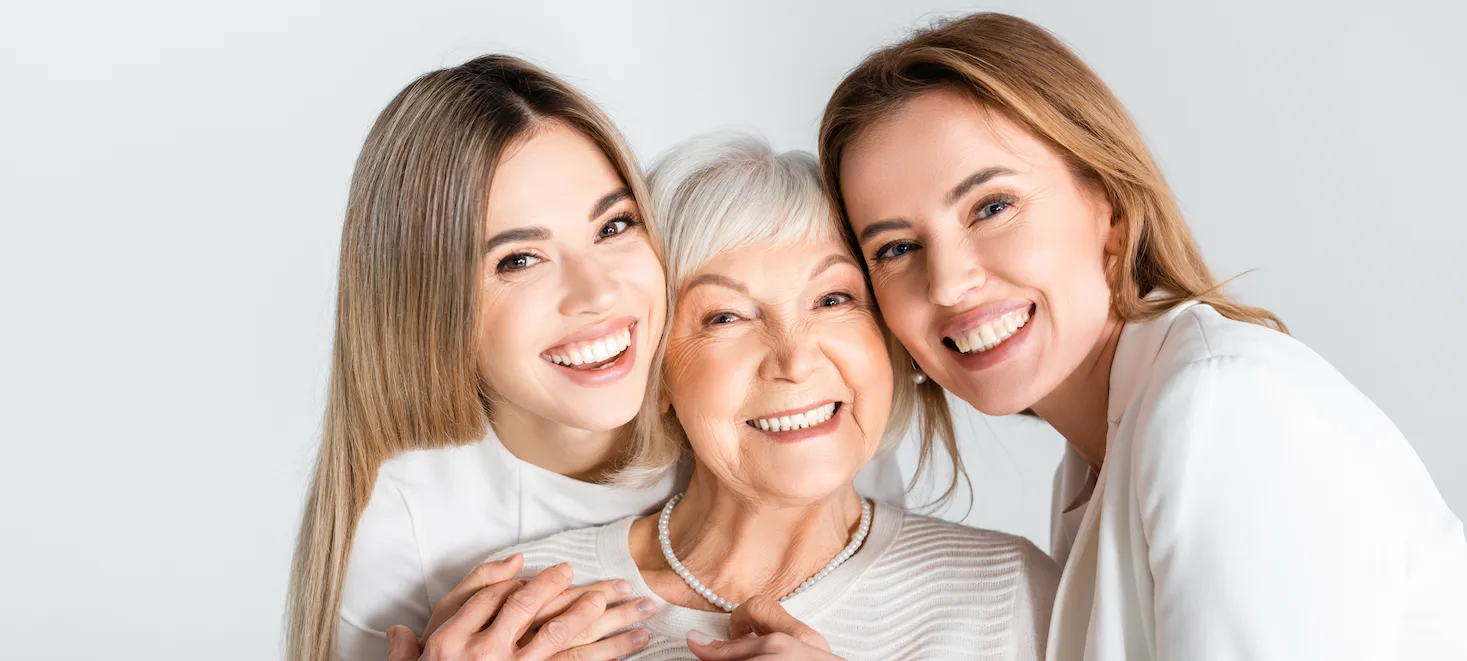 Women smiling with straight white teeth after Invisalign treatment in Pasadena