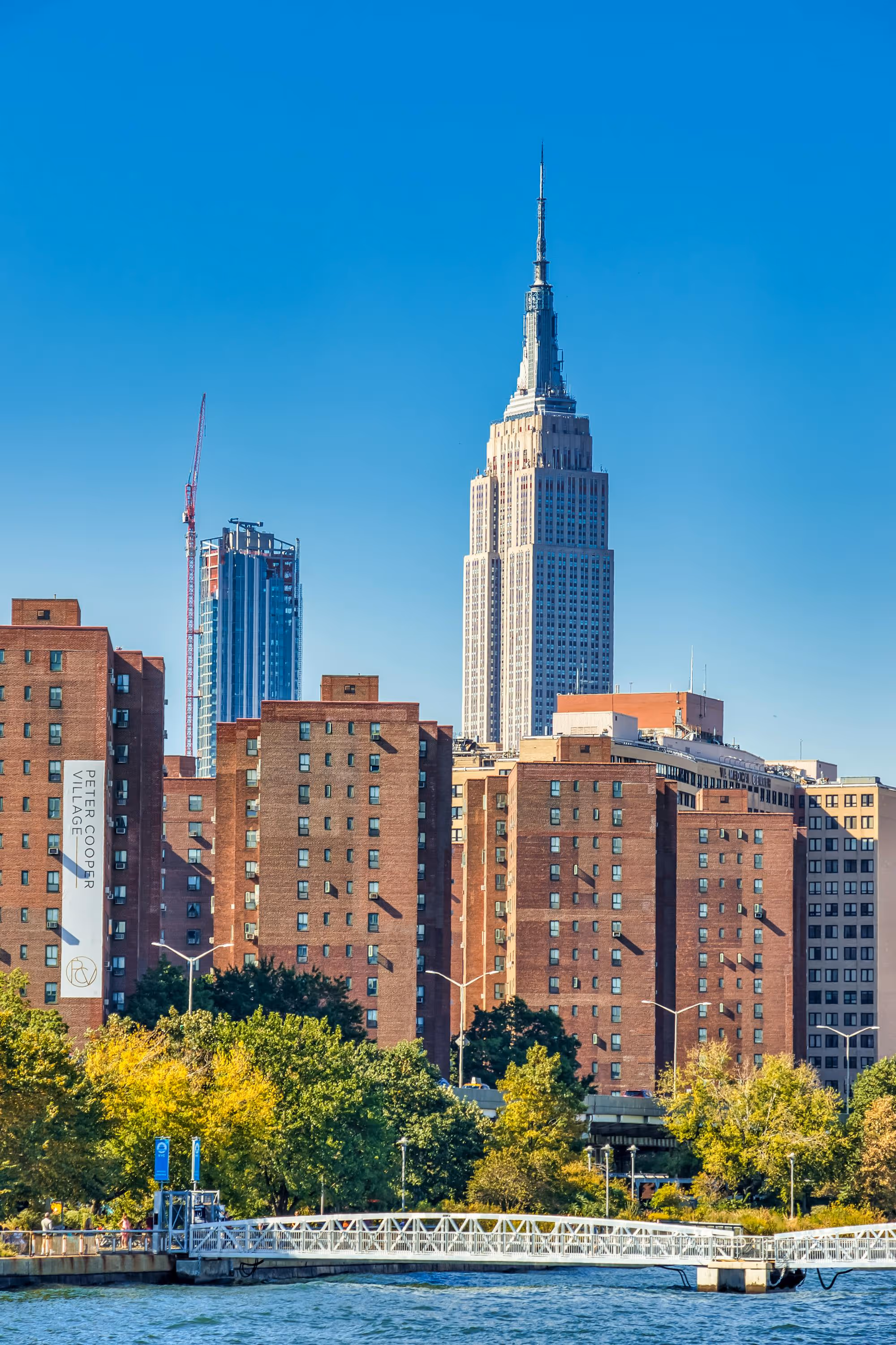 Empire State Building with nearby brick apartments