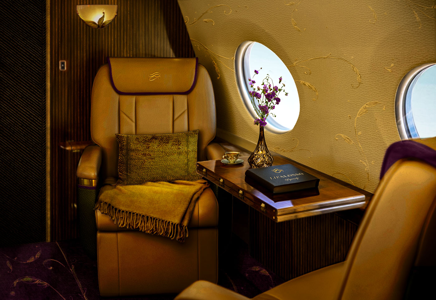 Luxurious tan leather airplane seat with golden throw blanket and pillow beside a wooden table holding a flower vase and a book near two airplane windows.