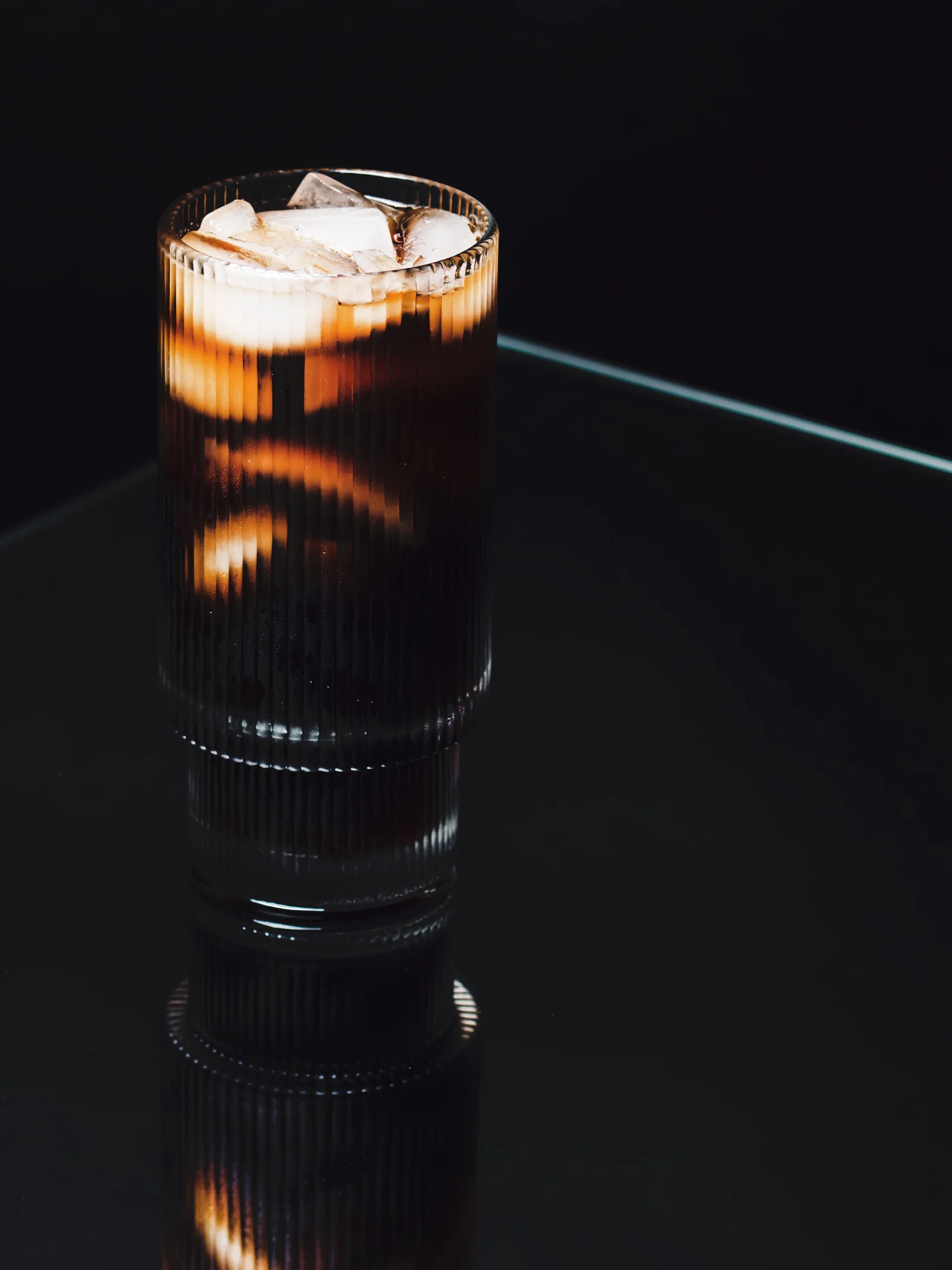 Cold Brew: slow-steeped cold brew over ice in a ribbed glass