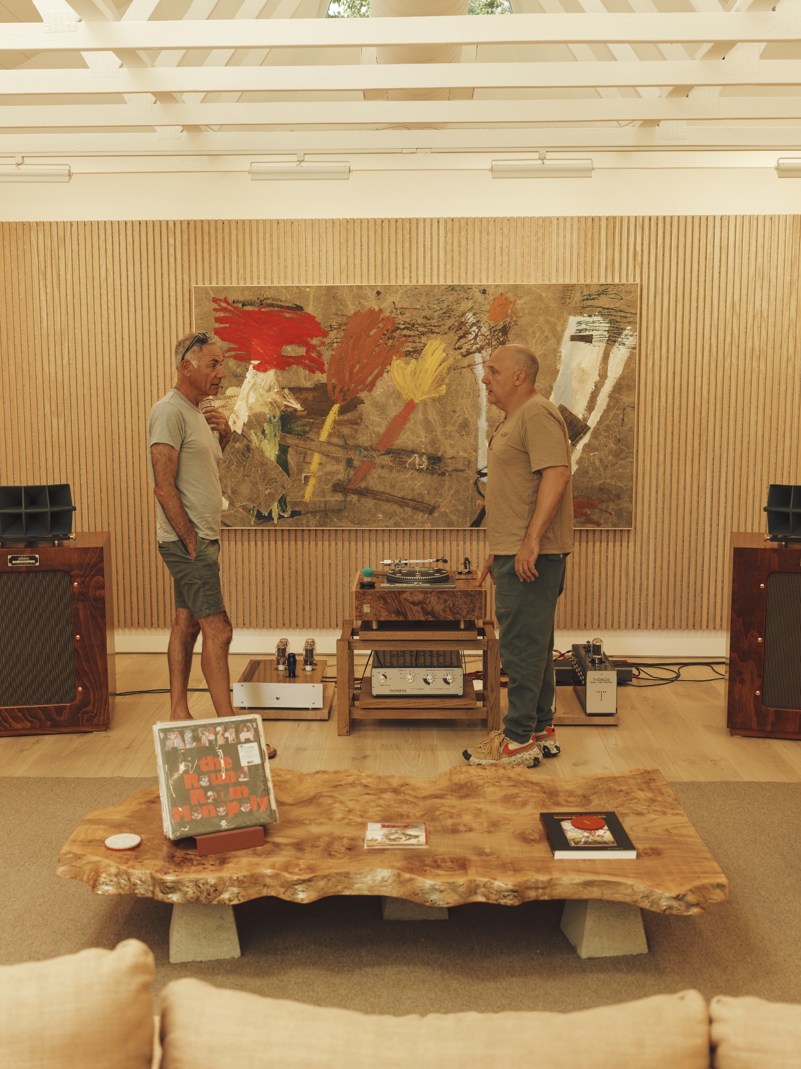 Conversation inside a private listening room designed for uninterrupted music listening.