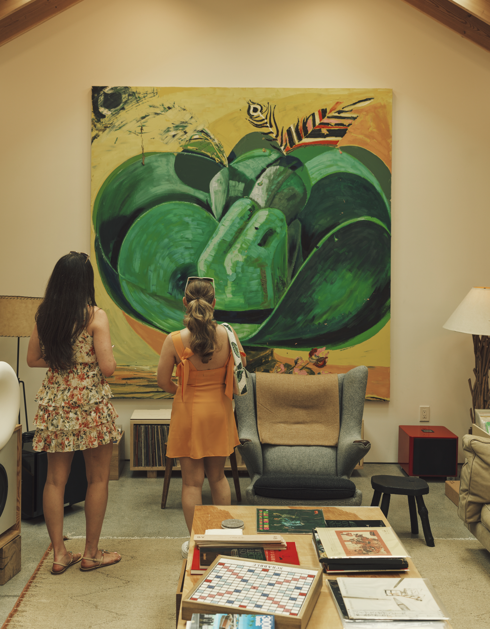 Visitors viewing artwork inside a quiet listening room space in Pasadena. 